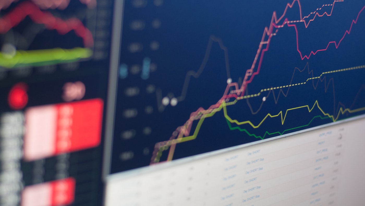 Colourful line charts on trading screens