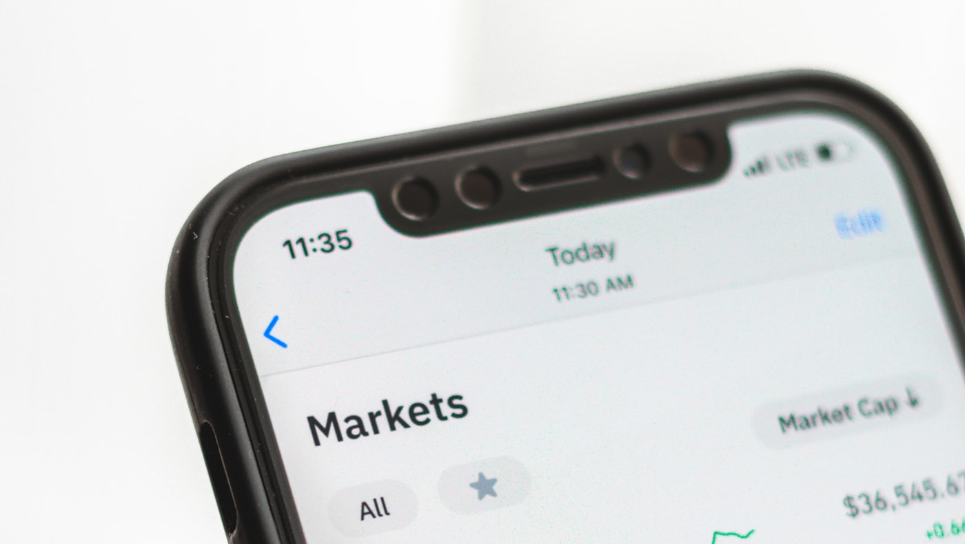 A smartphone showing a crypto markets app